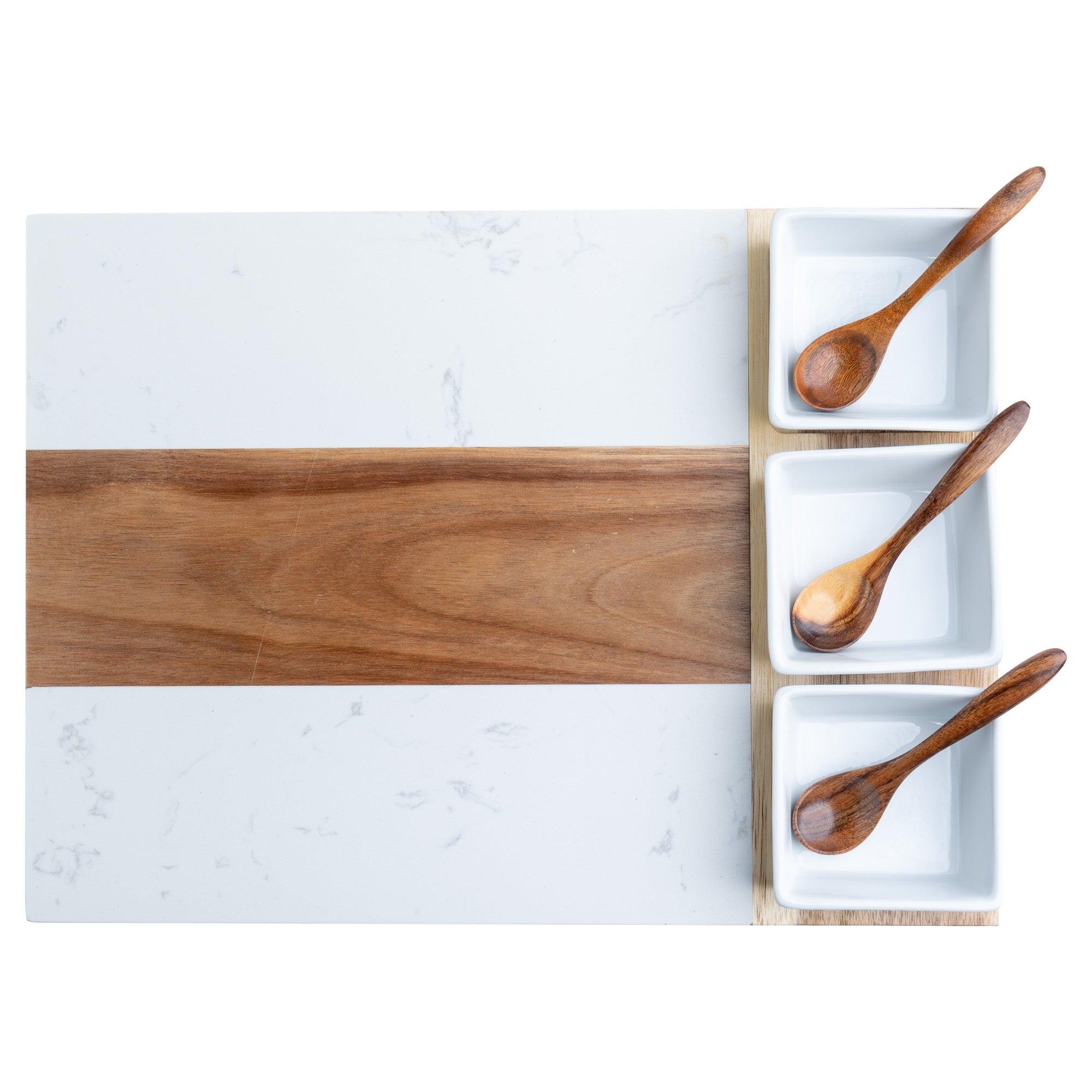 charcuterie board with sauce bowls and spoons